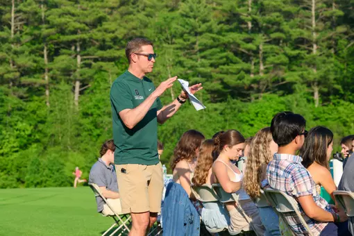 Mike Nelson speaks to his team