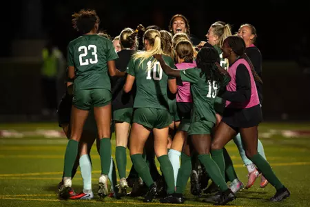 Women's soccer celebrates after Kate Ryan's goal