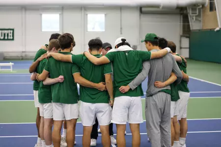Men's tennis group huddle