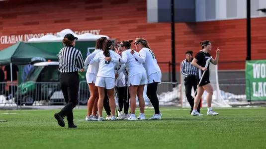 DWLAX celebrates a goal vs Bryant