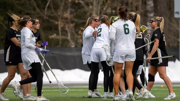 WLAX celebrates a goal vs Bryant