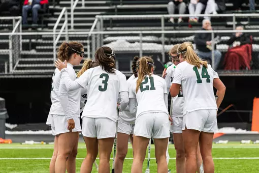 DWLAX huddles after a goal vs Penn