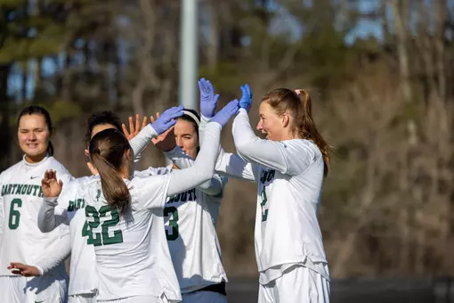 DWLAX high fives during starters