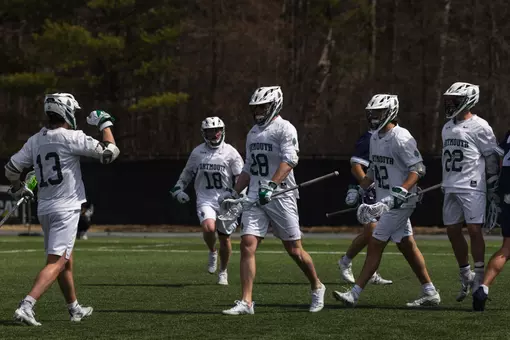 DMLAX celebrates goal vs Yale