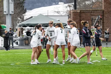 DWLAX celebrates a goal vs Penn