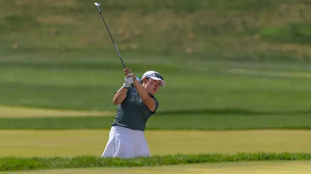 Wan chips onto the green