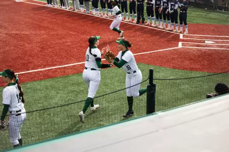 Softball cheering as they take the field