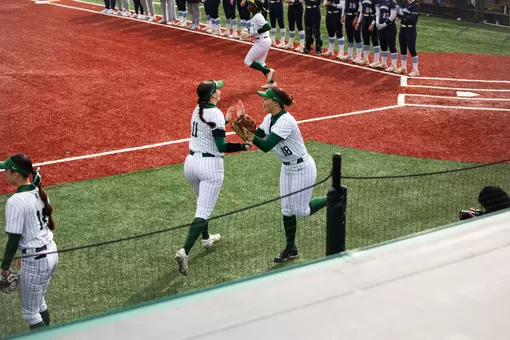Softball cheering as they take the field