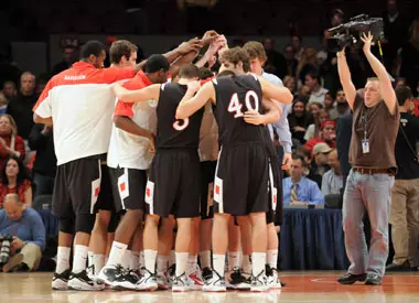 Men's basketball huddle.
