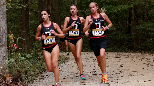 Photo of Susannah Cate, Katie MacTurk and Sophia Mills at the Queen City Invite