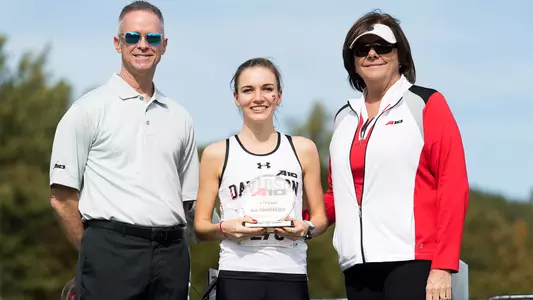 Photo of Laurel Sheffield accepting her A-10 All-Conference trophy