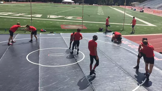 Photo of the wrestlers at Belk Track