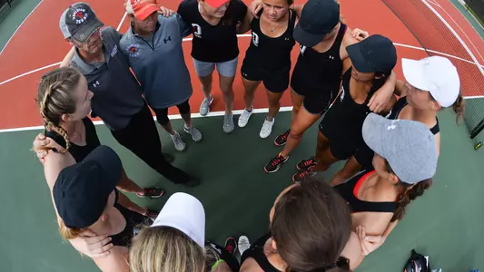 women's tennis team huddle