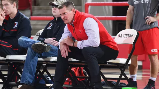 A photo of Coach Lausier on the bench