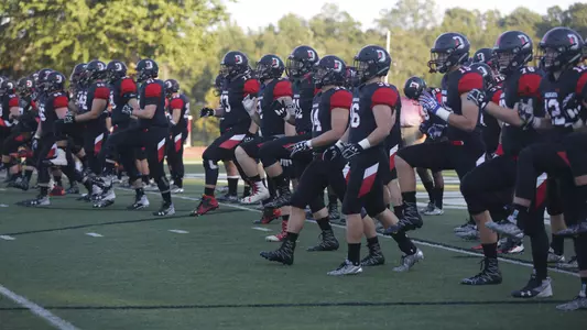 Photo of the football team warming up