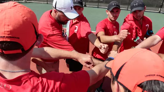 men's tennis team action