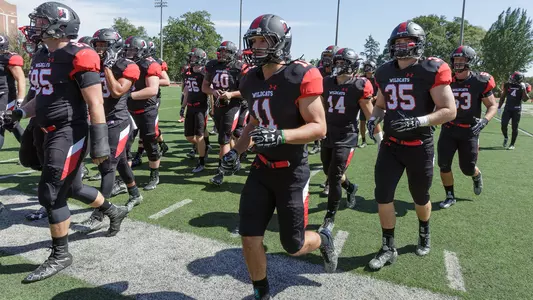 Photo of the football team heading to the locker room