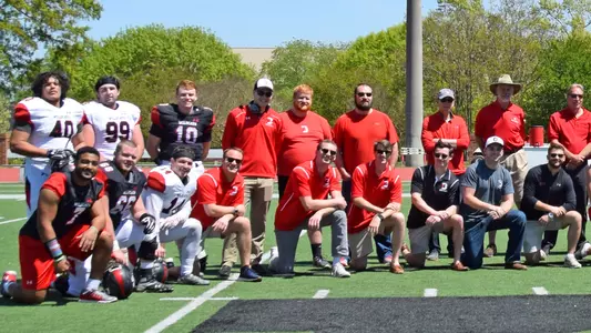 Photo of alumni and 2018 captains at the 2018 Spring Game