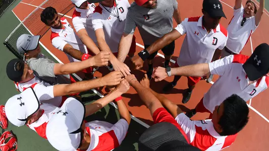 mens tennis team huddle