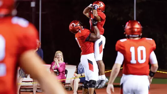 A photo of William Wicks and Zion Johnson celebrating a TD