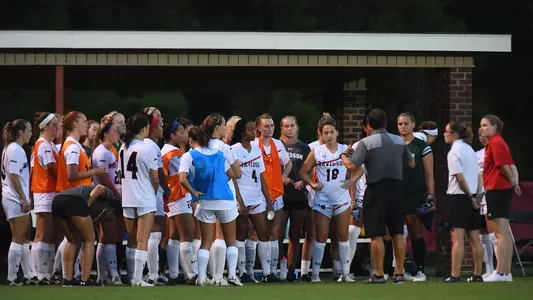 women's soccer team huddle