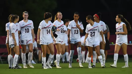 women's socer team huddle