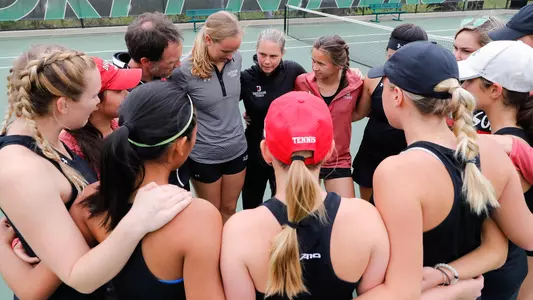 women's tennis team huddle