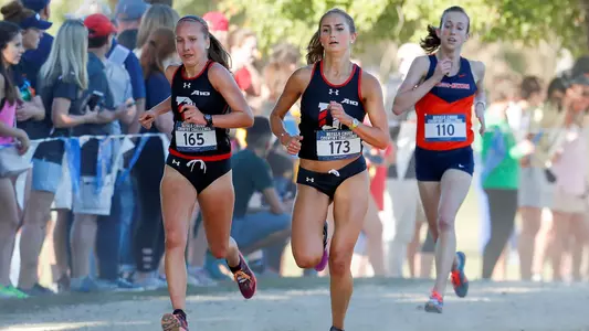 A photo of Natalie Abernathy and Maddie Hunter at the Royals XC Challenge