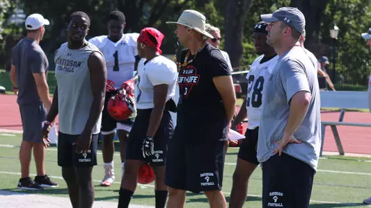 A photo of Coach Abell and Coach Berlin at practice