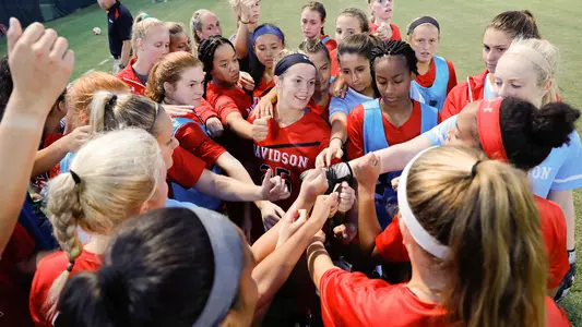 women's soccer team huddle