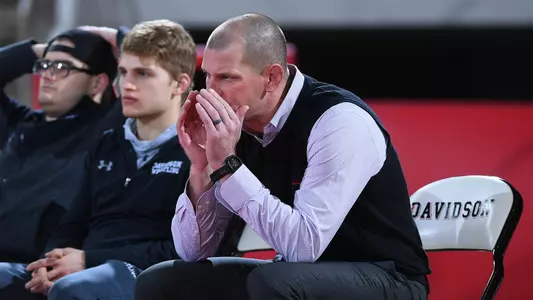 Head wrestling coach Andy Lausier on the bench