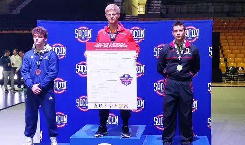 A photo of Tony Palumbo on the podium at the SoCon Championship