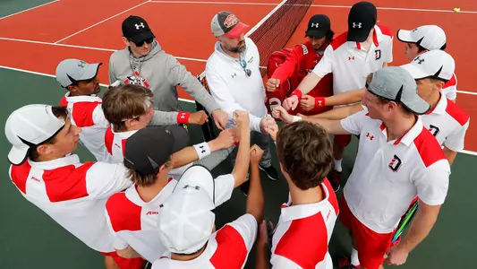 men's tennis huddle