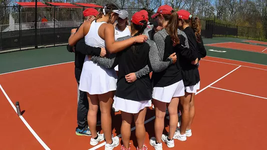 women's tennis team huddle