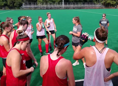 Head Field Hockey Coach Zoe Almquist With Team