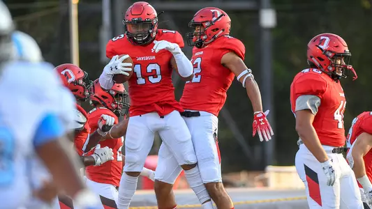Rayshawn McCall celebrates a pick six against Virginia Lynchburg