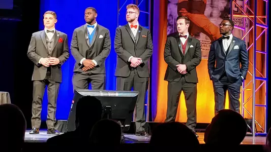 A photo of George Hatalowich being honored by Uplifting Athletes