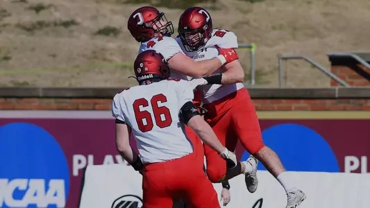 A photo of the football team celebrating a touchdown
