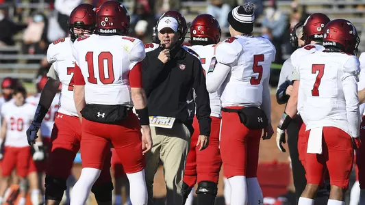 Coach Abell in the huddle at Elon