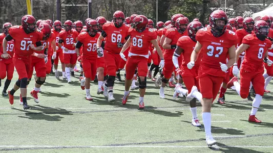 A photo of the football team running out