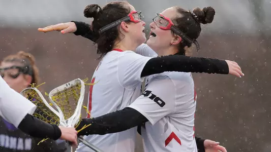 Gianna New/Grace Fahey hugging after goal
