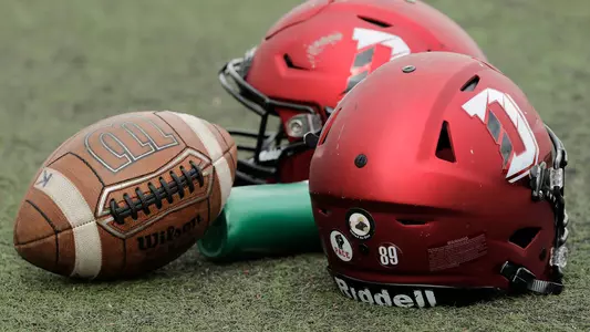 A PHOTO OF A FOOTBALL AND HELMETS