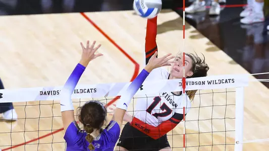 Malia Kay attacking at the net.