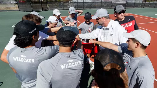 Men's tennis team prematch huddle