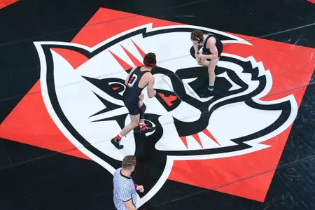 Noah Burstein wrestles opponent from Bellarmine in Duke Performance Hall