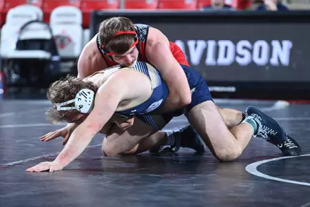 Gavin Henry wrestles against Queens