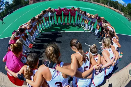 field hockey 2023 team huddle pink game