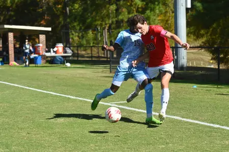 Nico Cavallo goes for the ball on the sideline against Rhode Island