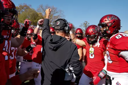 Coach Abell gathers his team on the sideline vs. Dayton