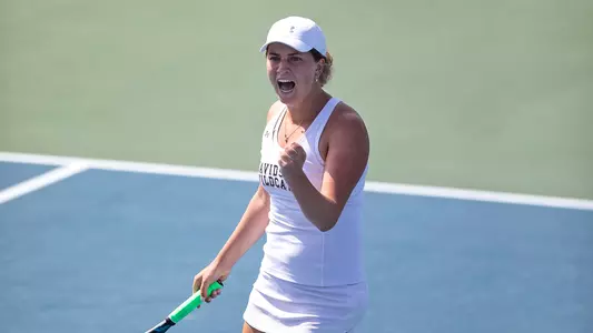 Franny Shea fist pumps after a point at the 2022 A-10 Championships